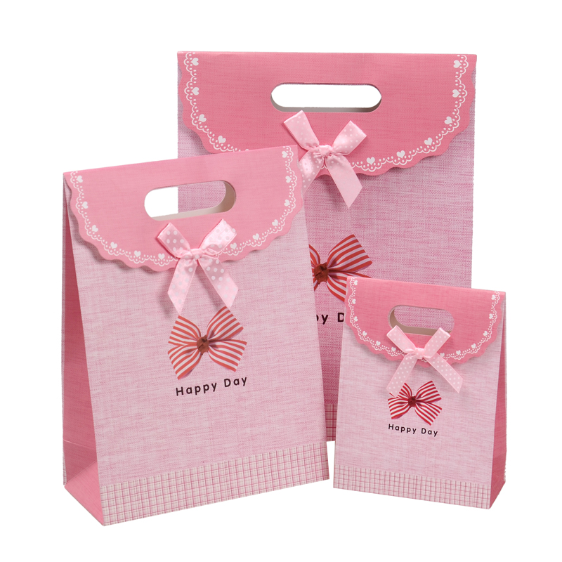 China wholesale decorative luxury recyclable fashion gift paper bags with your own logo