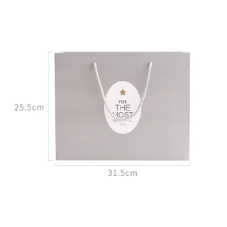 Custom different patterns and sizes gift paper bag with low price 