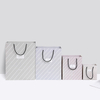 Wholesale luxury custom printed paper gift shopping retail bags with logo and handles