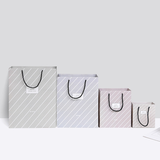 Wholesale luxury custom printed paper gift shopping retail bags with logo and handles