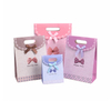 China wholesale decorative luxury recyclable fashion gift paper bags with your own logo