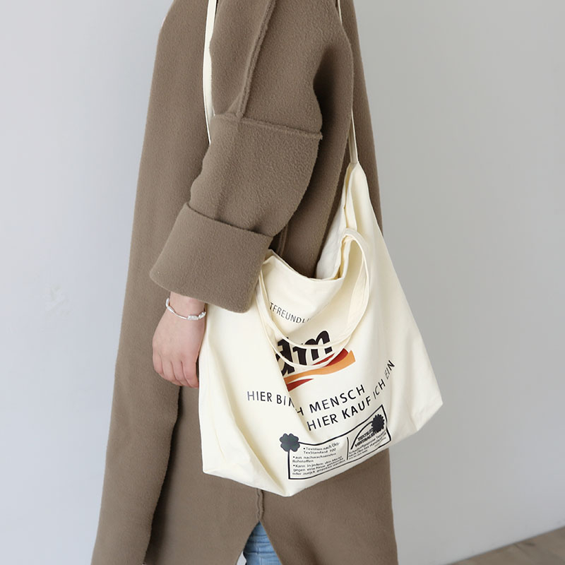 Thin breathable fashion letter printing large capacity canvas messenger bag with zipper inner pockets