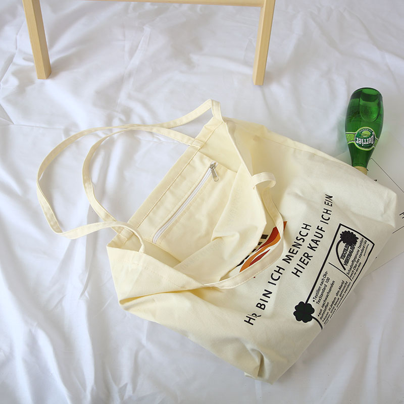 Thin breathable fashion letter printing large capacity canvas messenger bag with zipper inner pockets